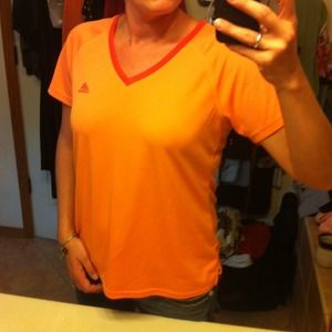 Peach Adidas workout shirt.
