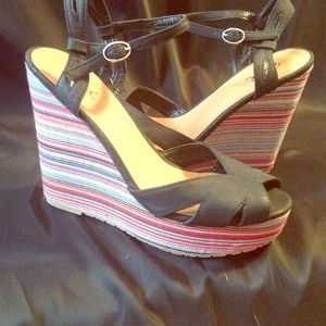 Black platform wedge with ankle strap.