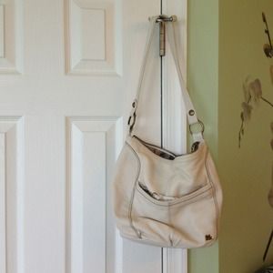 The Sak cream bucket bag