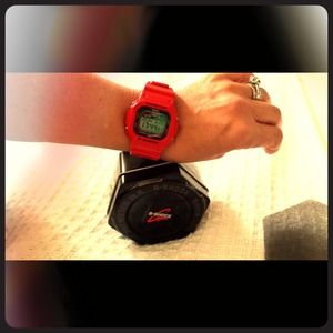 Brand new, bright red G shock watch.