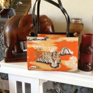 Orange embellished tiger purse.