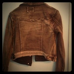 Faded black denim jacket.