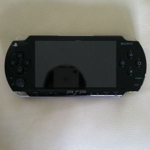 PSP with charger and 1 game $85