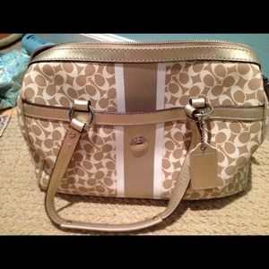 RESERVED Tan coach purse with purple lining