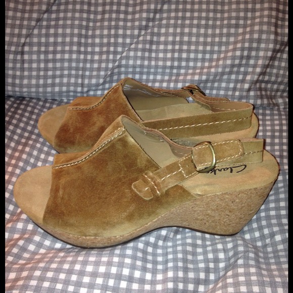 On hold...CLARK'S Brown Suede sling back wedge.