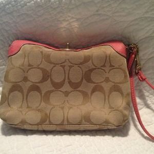 Coach salmon wristlet