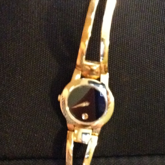 Authentic movado  museum gold tone