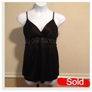 Dots sleeveless slinky top. Adjustable straps.