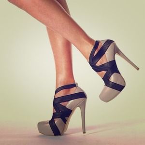 Sold** Reserve** tan and black heels Colin Stewart