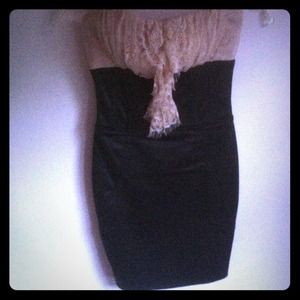 Sexy nude and black dress with lace ruffles.