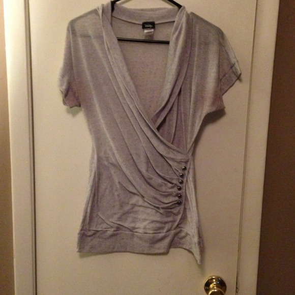 Gray v-neck top.