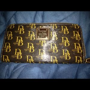 RESERVED. Dooney & Bourke wallet never used