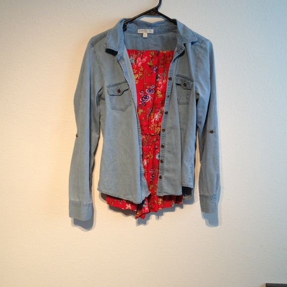 Light blue jean jacket and red floral romper.