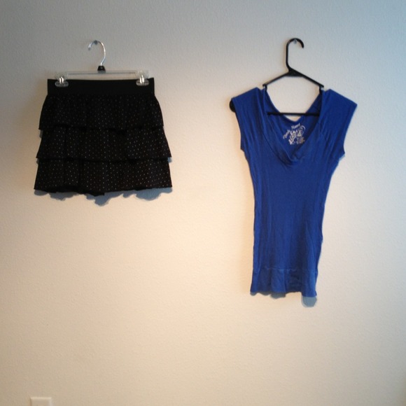 Dark blue t-shirt, and black Polkadot mini skirt.