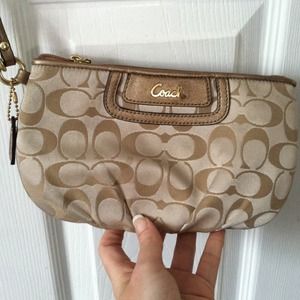 Gold coach wristlet