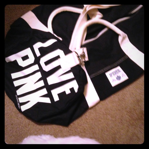 Huge black and creamy white duffel bag