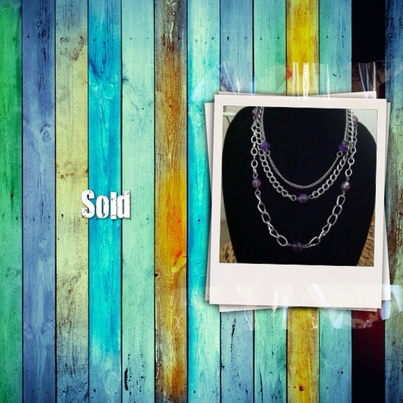 Adjustable beautiful purple and silver neckless.
