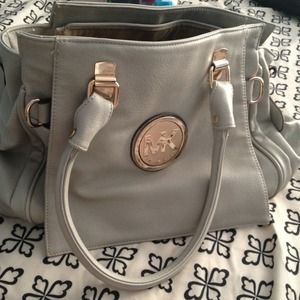 Michael Kors creamcolor multiply compartment bag.