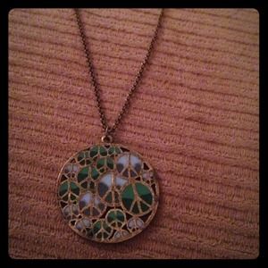 Peace sign necklace.
