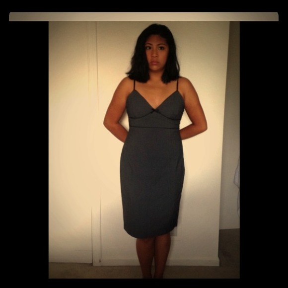 A classic gray dress with black ribbon accent