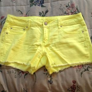 Neon yellow midi cutoff shorts