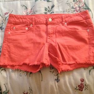Orange denim midi cutoff shorts
