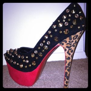 Studded pumps with cheetah print heel.