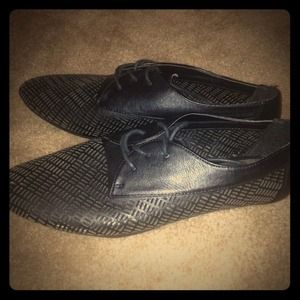 Black tie up flats. Never worn.