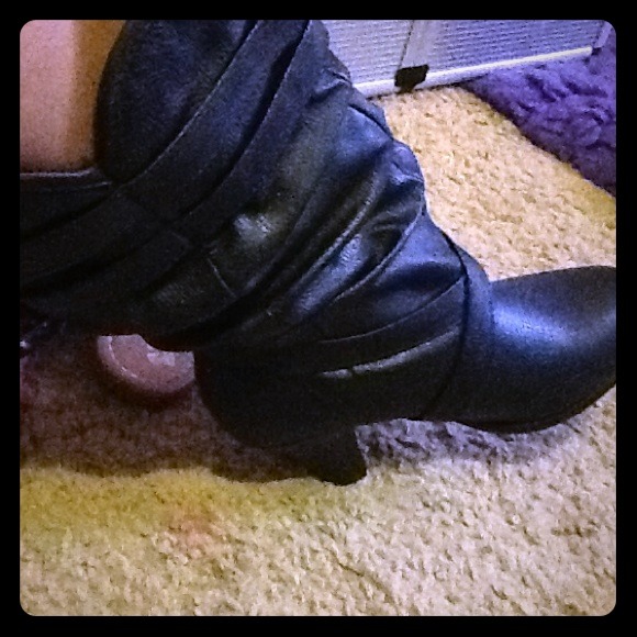 Black leather boots with a 3 inch heel