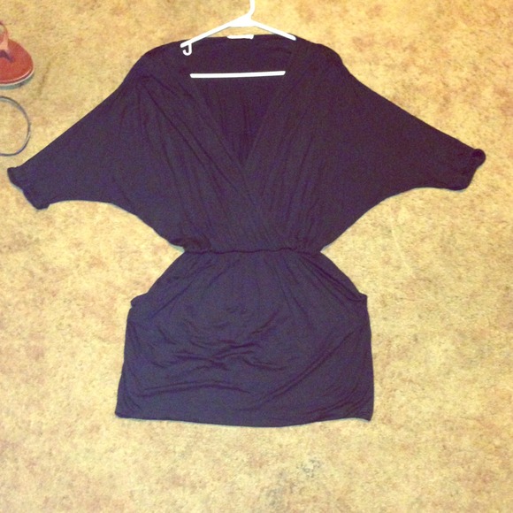 Black loose dress. With a deep V.