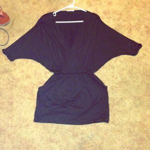 Black loose dress. With a deep V.