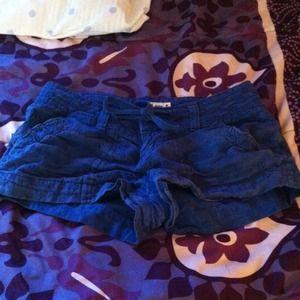 Navy blue floral patterned jean shorts.