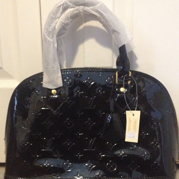 **Sold**Black Patent Leather Handbag