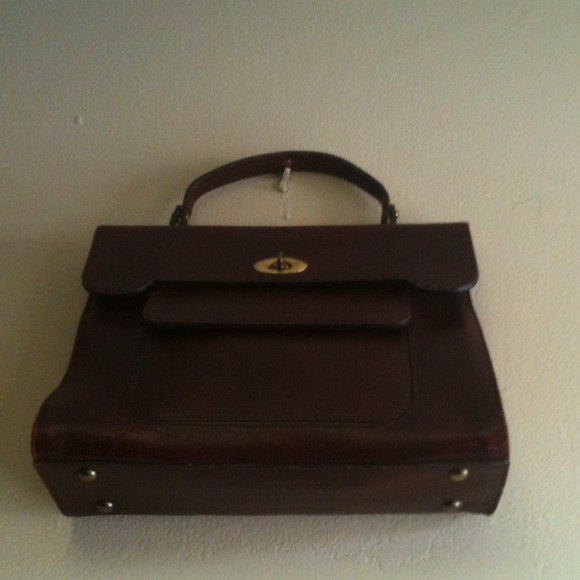 Vintage leather handbag with brass handles