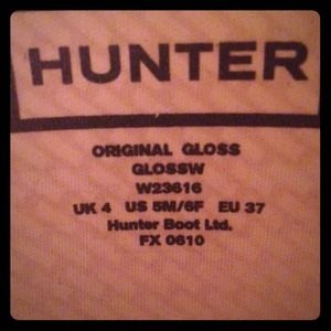 Gray tall hunter boots.