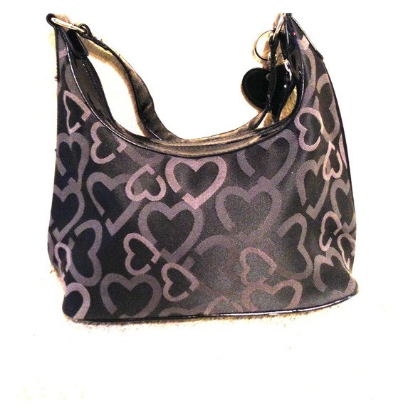Medium-sized black purse with gray heart pattern.
