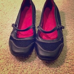 Casual black flats with red inside.