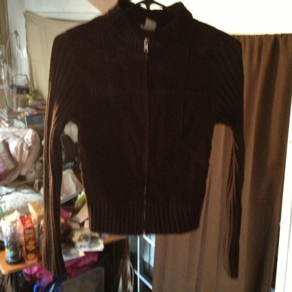 A fitted brown sweater with a high neck