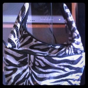 This is a beautiful black and silver purse.