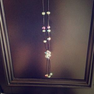 Long black necklace with multi-colored beads.
