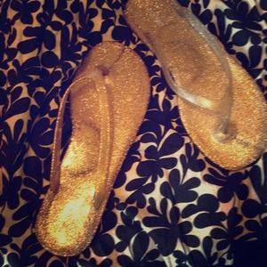 Gold glitter jelly flip flops