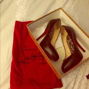 Authentic Christian Louboutins , black pumps .