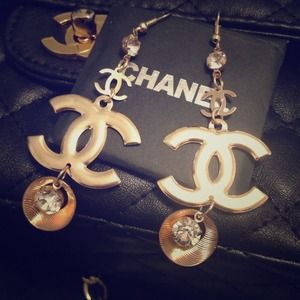 Gold tone rhinestone CC dangling earrings