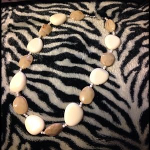 Cute ivory and tan necklace.