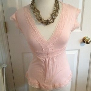 Pink tie back blouse with lace detailing