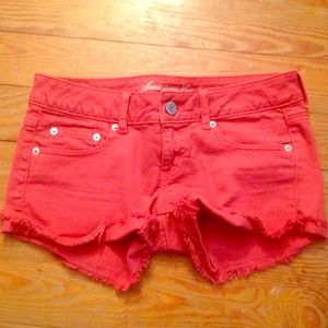Dark coral cutoffs