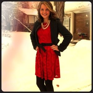 Red lace dress with ribbon belt.