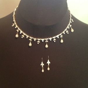 Elegant faux pearl necklace and earrings.