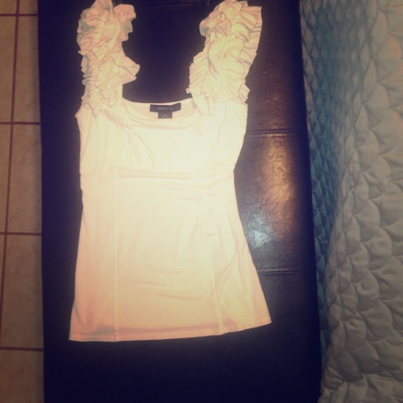 White top with ruffle on shoulders