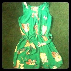 Green Base Romper with Floral print. Silk texture.